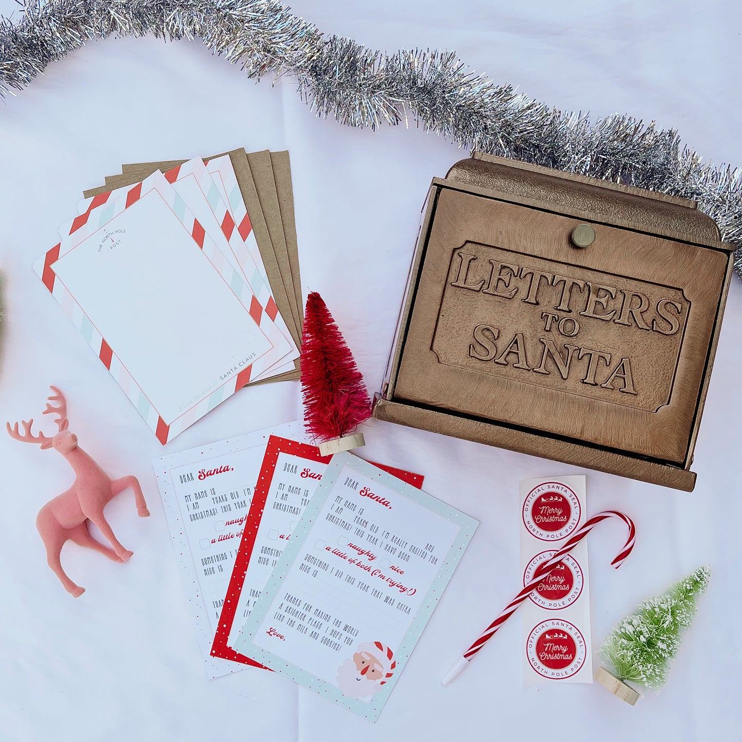 Santa North Pole letter kit that includes three letters to Santa, three blank letters from Santa, three envelopes and North Pole seals and a candy cane pen. 